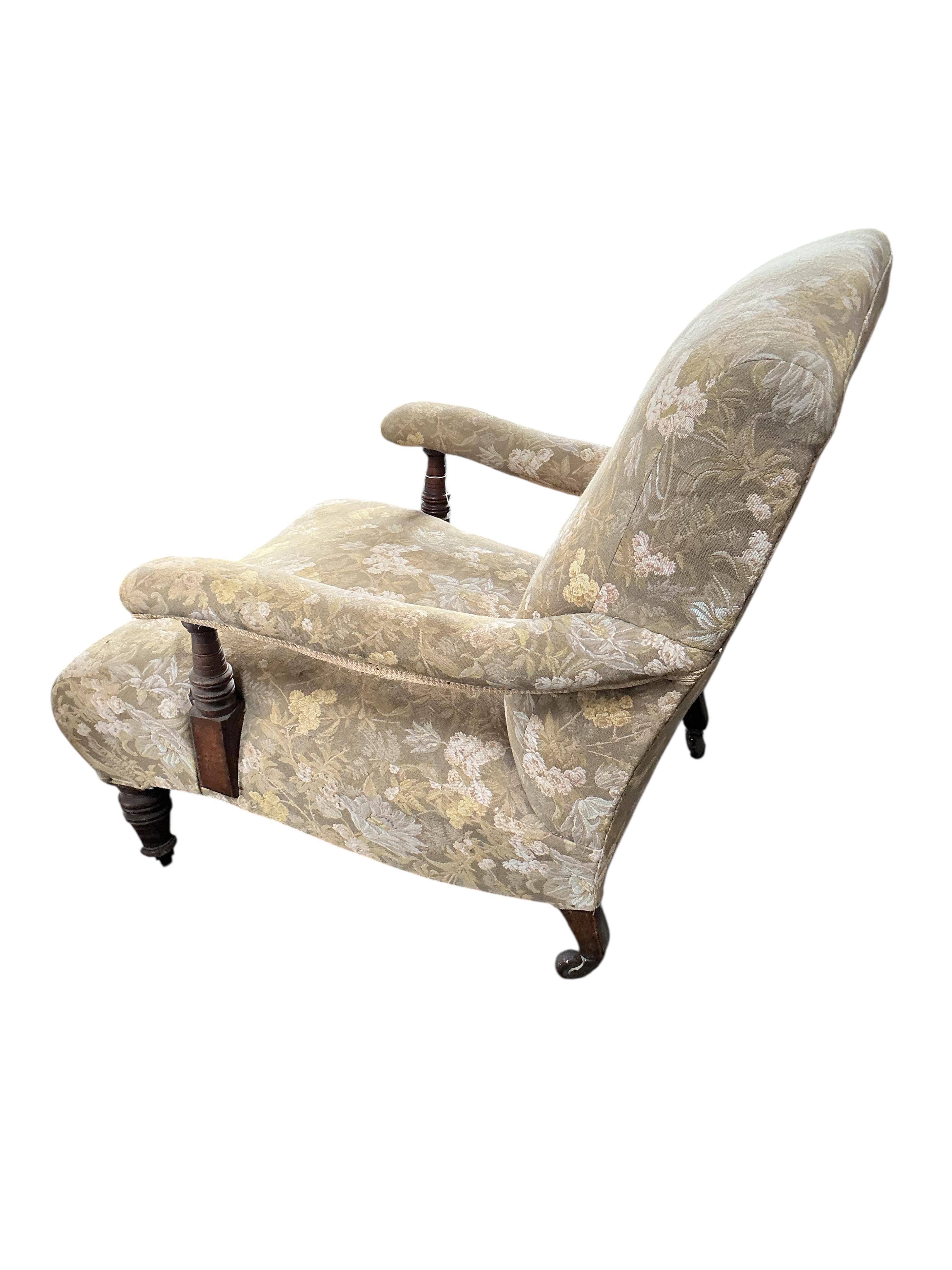 A Victorian Howard style upholstered open armchair, width 74cm, depth 100cm, height 100cm